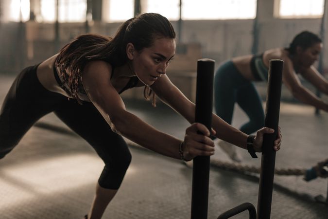 Fit women exercising at gym
