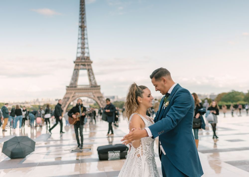 Happy newlyweds in wedding clothing dancing together