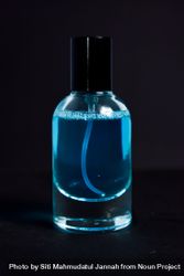 Light blue perfume bottle in studio shoot 0yXzLO