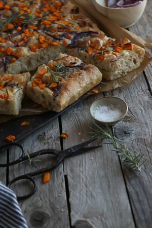 Pieces of fresh focaccia on wooden table