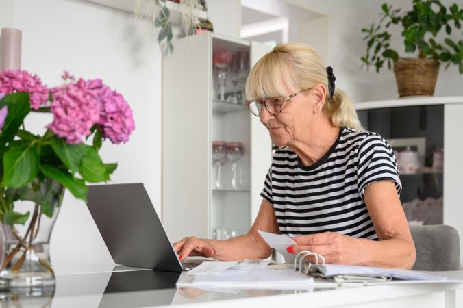 Older woman working on laptop