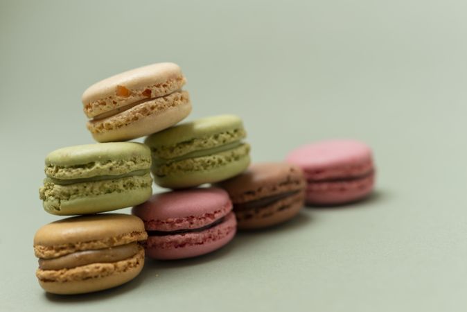 French pastel macaroons on a green background