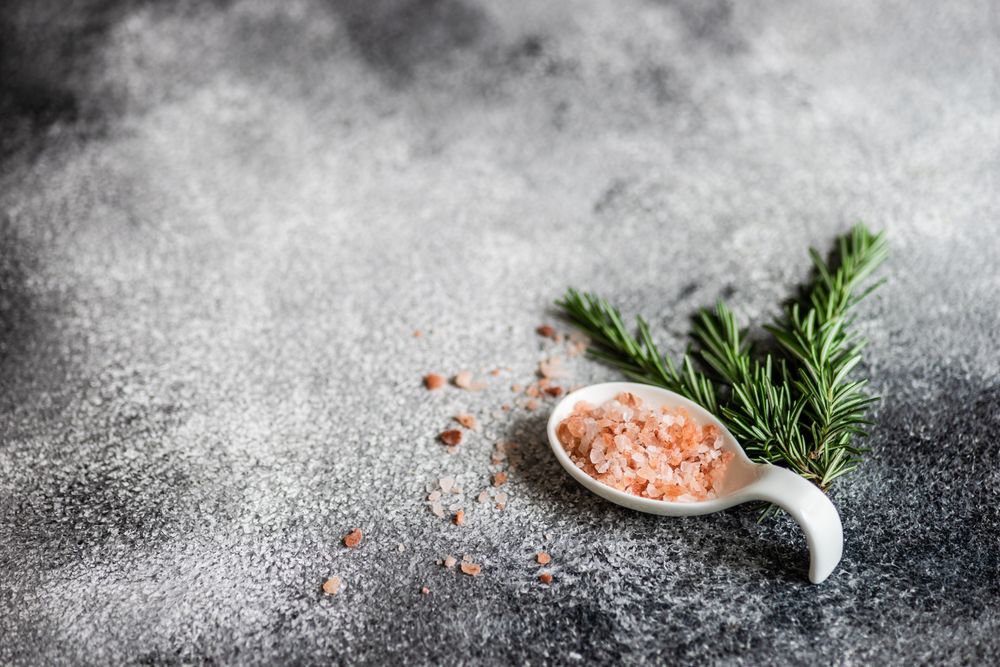 Table setting with rosemary and salt