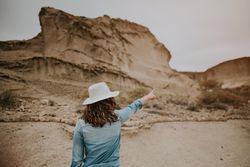 Female tourist walking on sandy quarry
