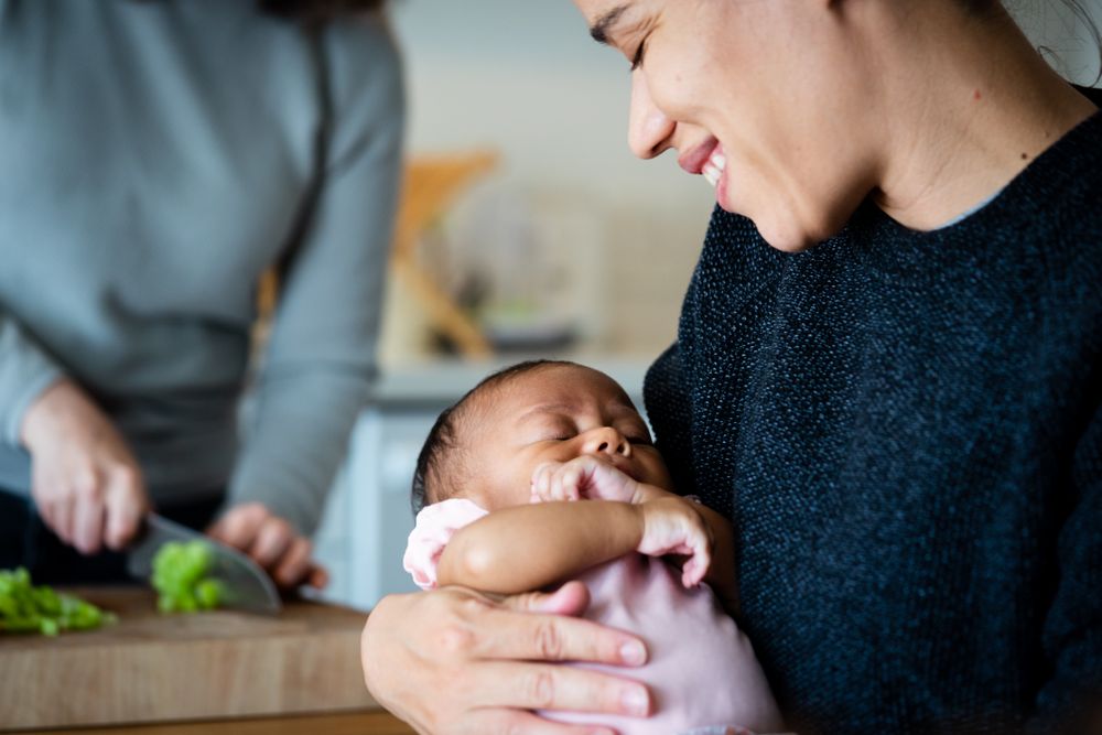 Close up of mother and baby in kitchen