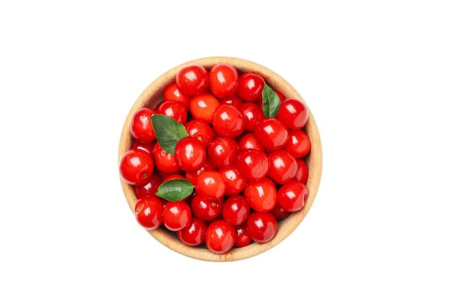 Bowl with fresh red cherry isolated on blank background