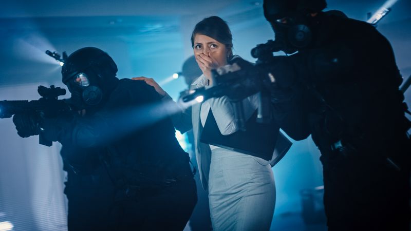 Soldiers with Rifles and Flashlights Move Forwards and Cover Surroundings.