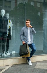 Young man with shopping bags