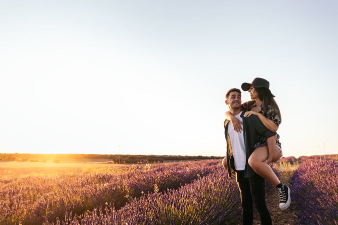 Lovely young couple in a floral field