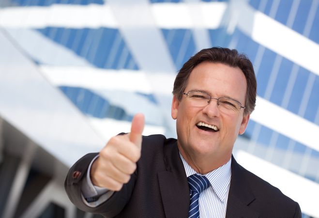 Confident Businessman with Thumbs Up