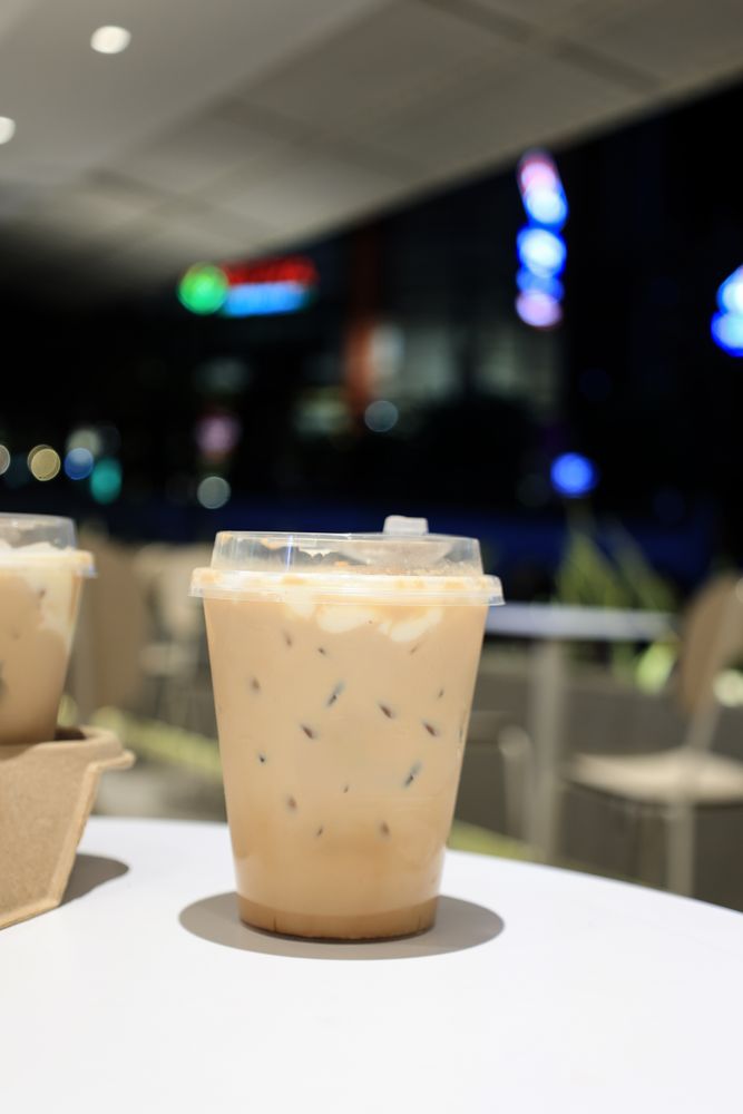 Iced Cloud Coffee in Plastic Cup at a Coffee Shop