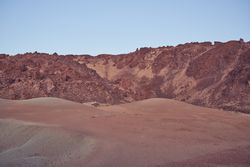 Mountains near sandy terrain in nature