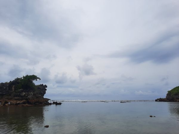 Cloudy Beach Reflections
