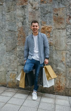Young man with shopping bags