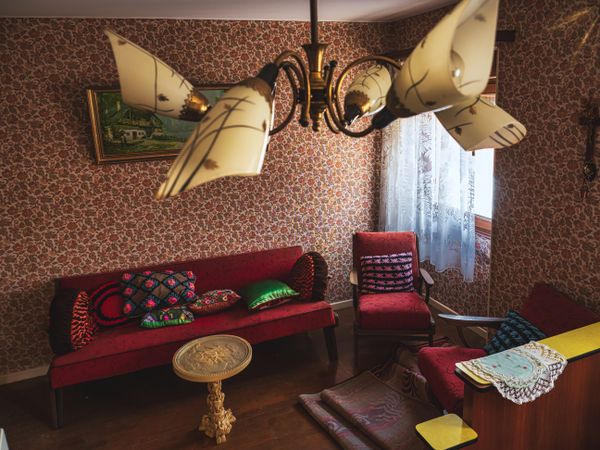 Interior of an old village house. Old furniture, chandelier, bathroom, old things, old dishes, glasses.