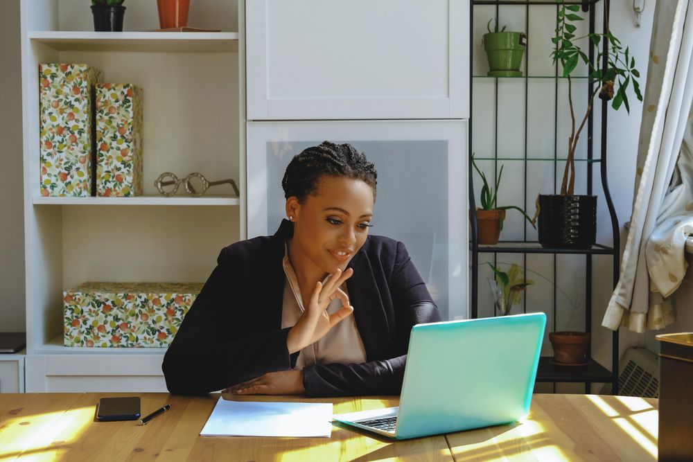 Business owner working on her laptop in her home office