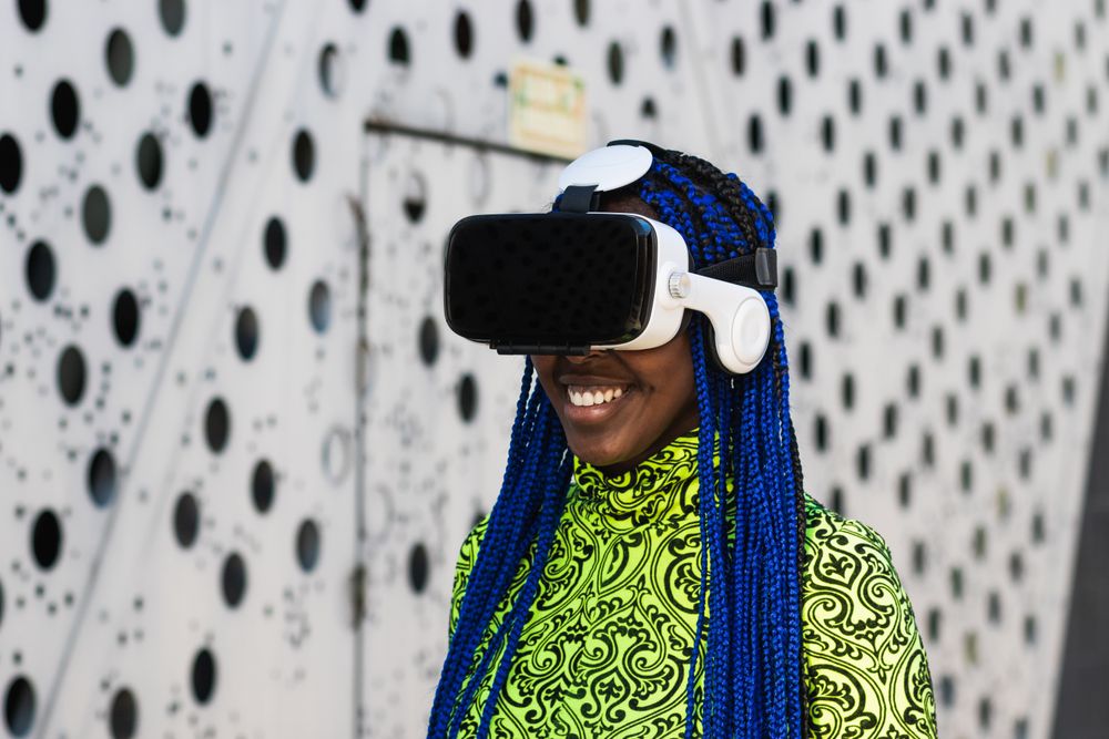 Black woman in VR headset in city