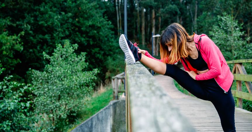 Athlete woman doing leg stretch