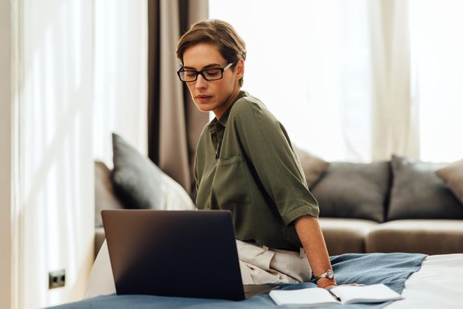 Businesswoman working from a modern apartment