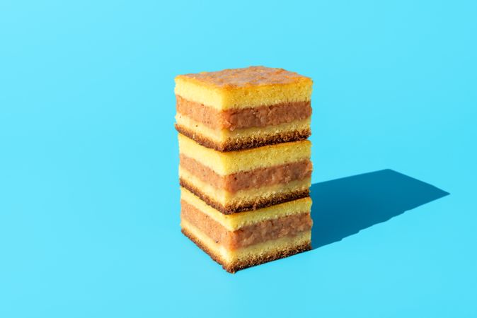 Apple cake slices isolated on a blue background