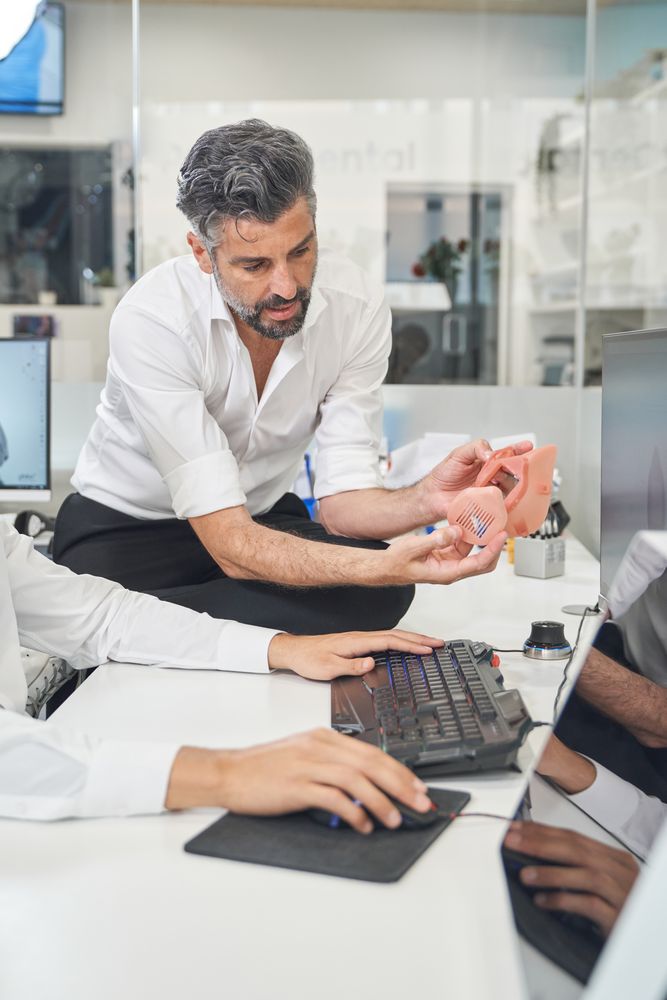 Man with printed facial mask in office
