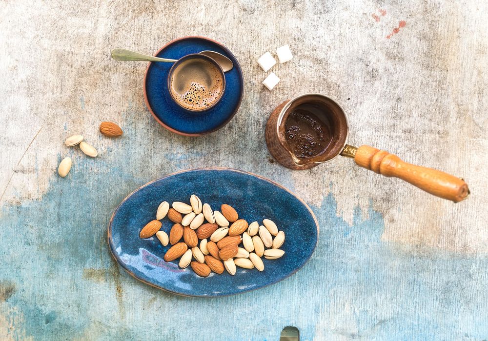 Top view of Turkish coffee with almonds