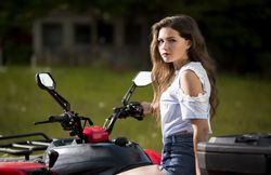 Young woman on ATV in nature