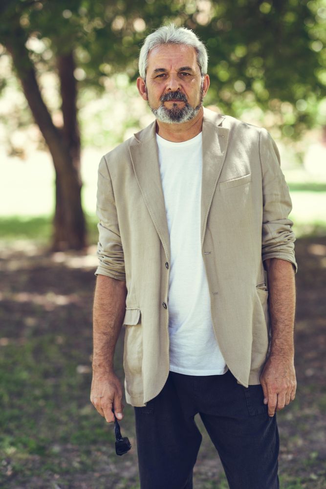 Portrait of a mature man standing in a park