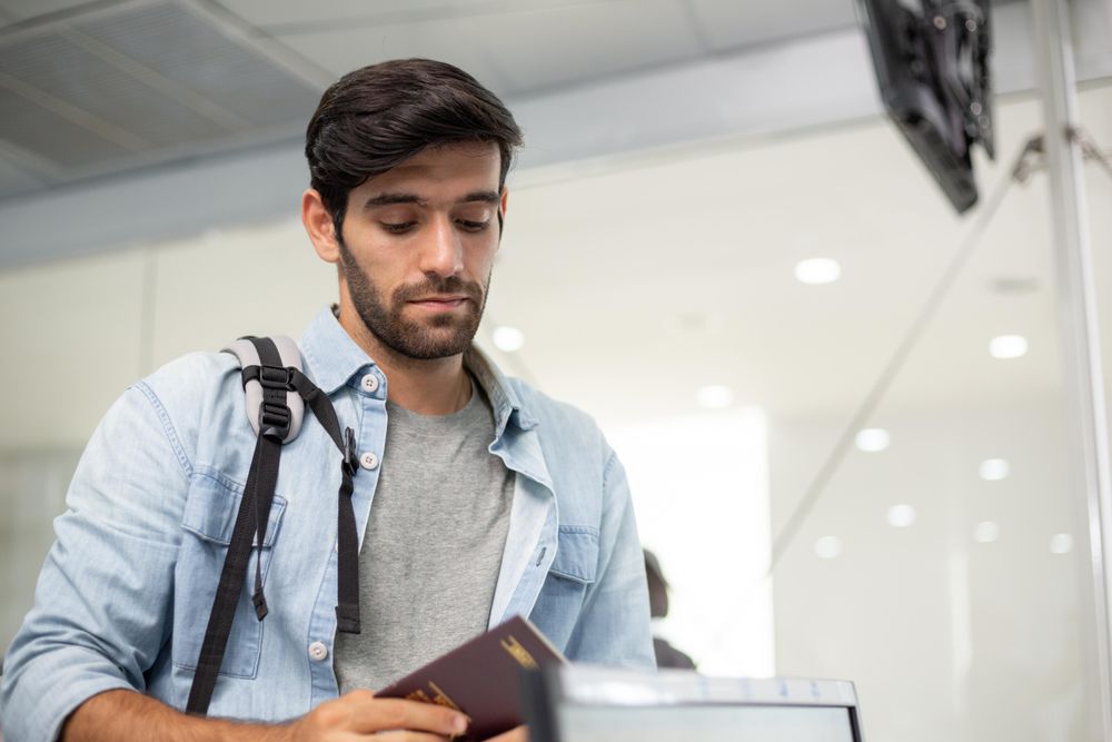 Male with passport in airport
