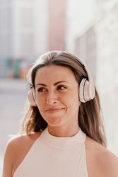 Brunette listening to music in sunlight
