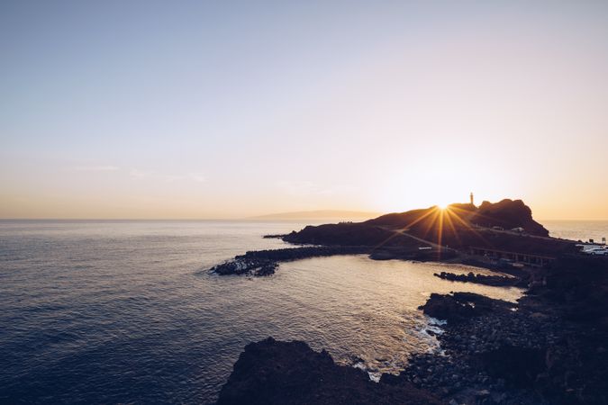 Remote rocky seaside at bright sunset