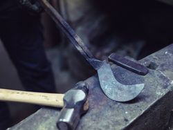Crop blacksmith showing metal detail on anvil