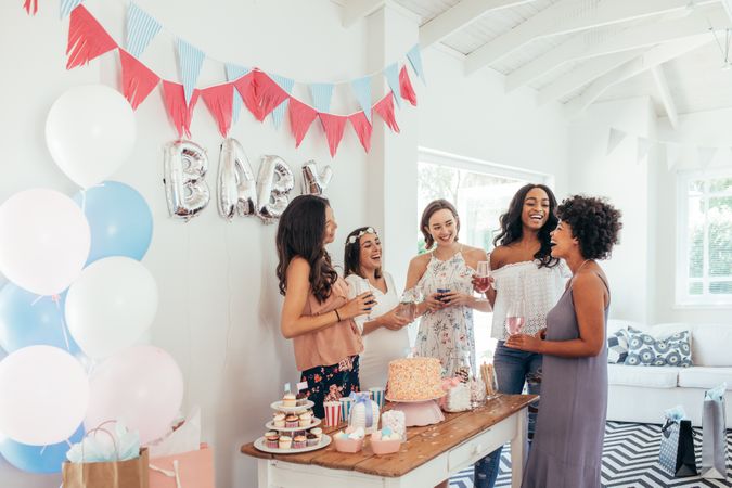 Baby shower with women and cakes