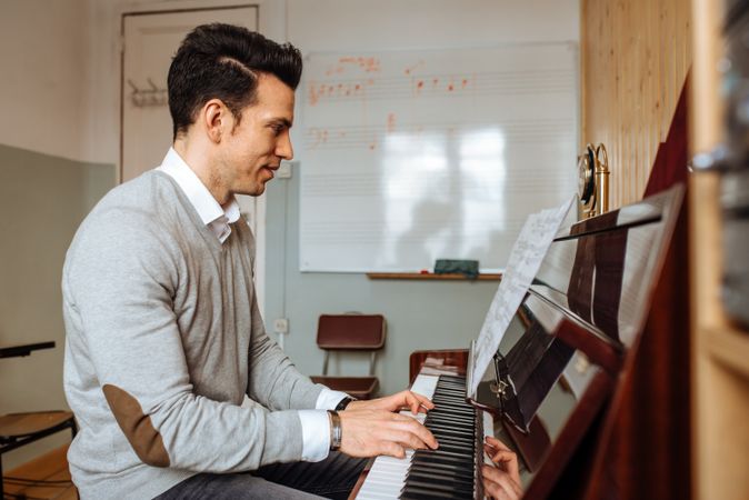 Man playing piano in studio