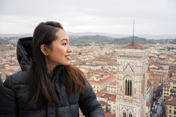 Cheerful tourist against ancient city