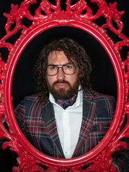 Portrait of imposing man in red art frame