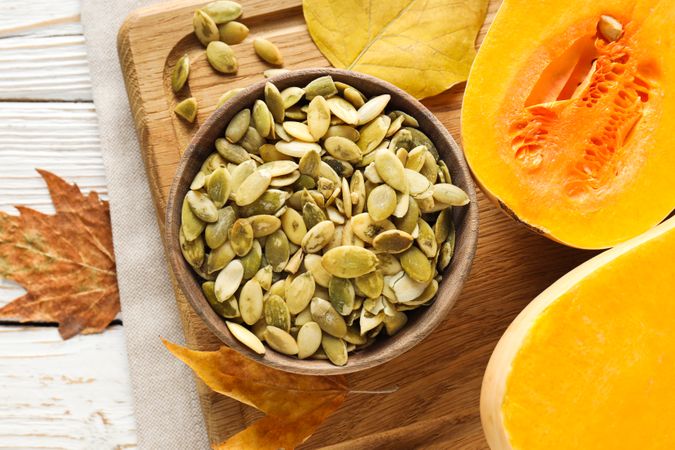 Cooking ingredients for fall season - pumpkin seeds, pumpkin