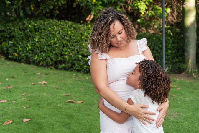 The mother and daughter spend time together outdoors.