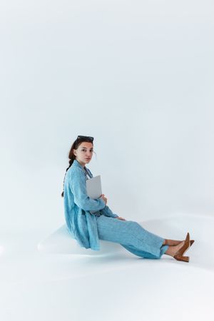 Woman with laptop in studio