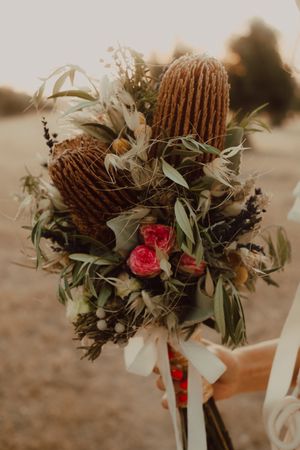 Woman in dress with flower bouquet