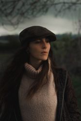 Young woman in warm clothes in forest
