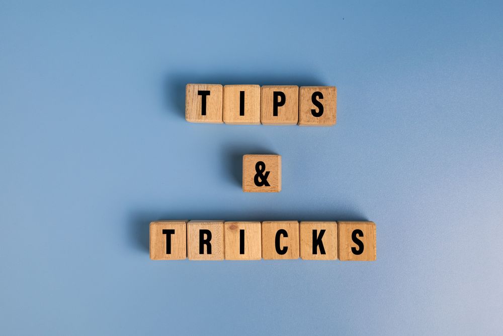 tips and tricks words on wooden blocks isolated on blue background
