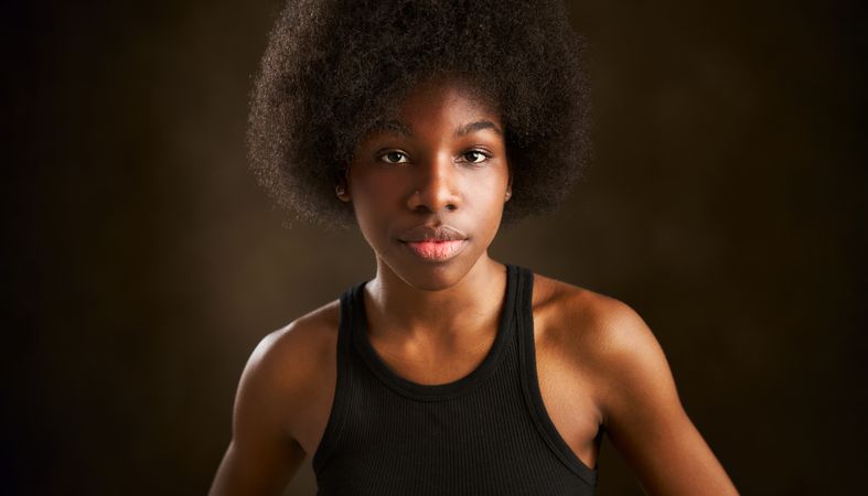Portrait of a young Black woman with curly black afro