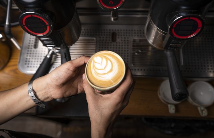 Barista making coffee with latte art