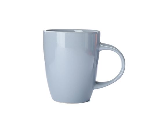 Empty ceramic cup isolated on studio background