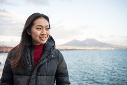 Woman on vacation in warm wear on seashore