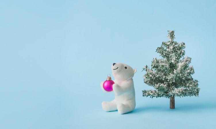Polar bear toy with Christmas tree and ball ornament