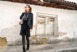 Woman smoking in the street