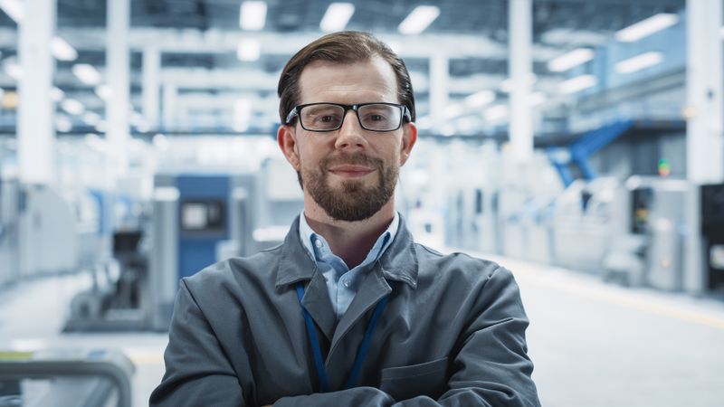 Portrait of happy male scientist in lab