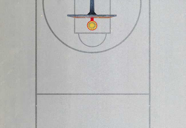 A photo of a minimal basketball field seen from the above